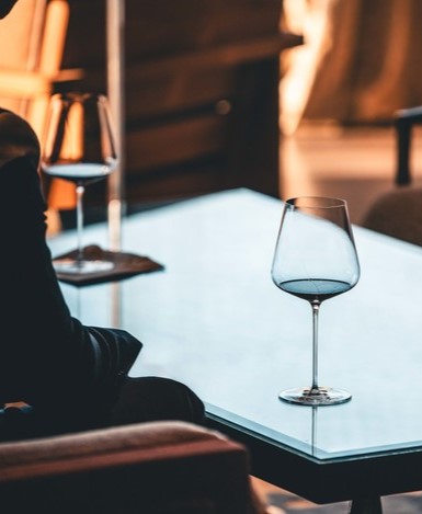 A glass of Opus One red wine on a glass in the Oakville Partners' Room.